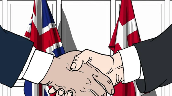 商人或政界人士与英国和丹麦的国旗握手。正式会议或合作相关卡通插图 — 图库照片