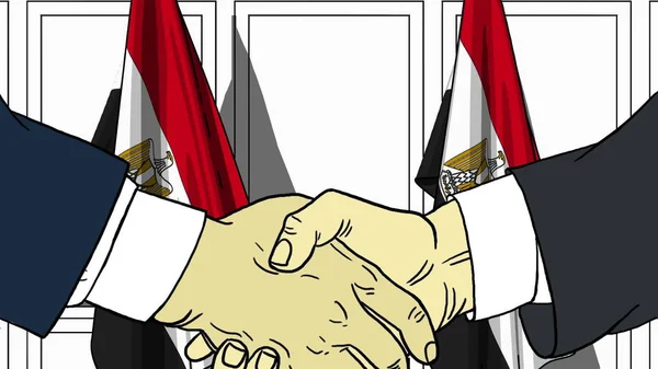 Les hommes d'affaires ou les politiciens serrent la main contre les drapeaux de l'Egypte. Réunion officielle ou illustration de bande dessinée liée à la coopération — Photo