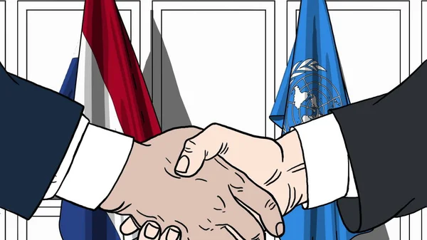 Businessmen or politicians shake hands against flags of Netherlands and United Nations. Official meeting or cooperation related editorial illustration — Stock Photo, Image