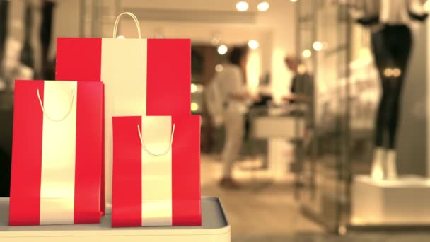 Shopping bags with flag of Austria against blurred store. Austrian shopping related clip — Stock Video