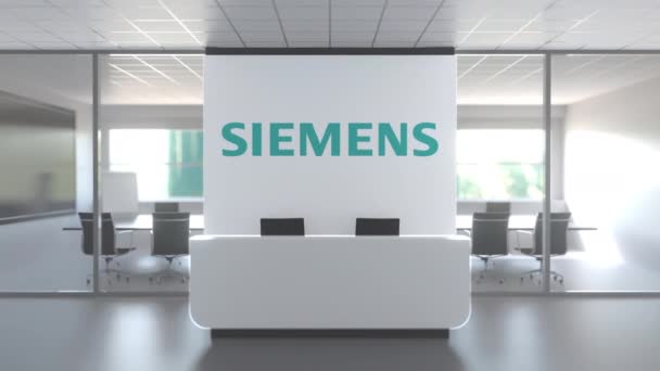 Logo of SIEMENS on a wall in the modern office, editorial conceptual 3D animation — ストック動画