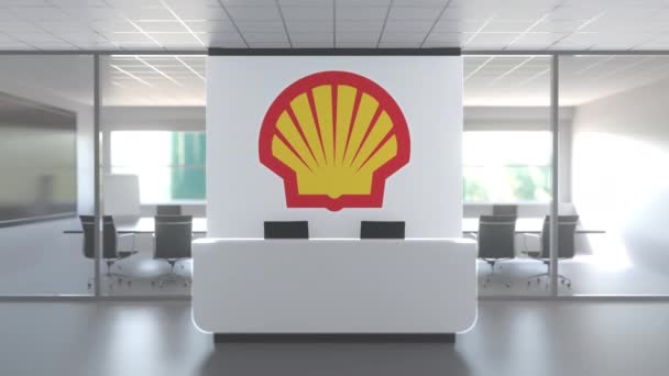 ROYAL DUTCH SHELL PLC logo in modern office and a meeting room, editorial conceptual 3D animation — стокове відео