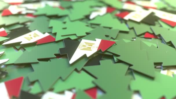 Details of flag of Egypt on the souvenir Christmas trees. Winter holidays related 3D animation — Stock videók