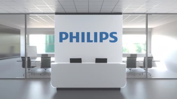 現代オフィスの壁にKoninklijkeフィリップスN.V.のロゴ,編集概念的な3Dアニメーション — ストック動画