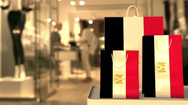纸袋上的埃及国旗挡住了模糊的商店入口. 零售相关3D渲染 — 图库照片