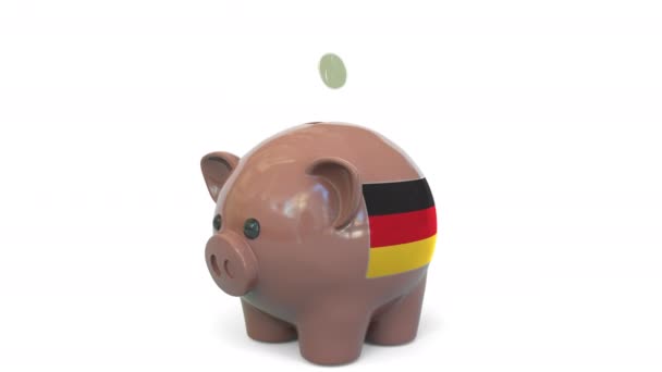 Lägga pengar på spargris med Gemanys flagga. Skattesystem eller sparrelaterad begreppsmässig 3D-animation — Stockvideo