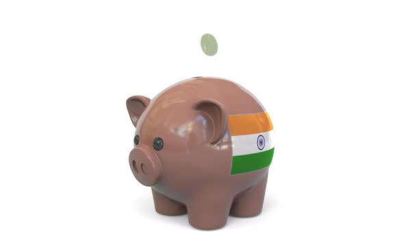 Putting money into piggy bank with flag of India. Tax system system or savings related conceptual 3D animation — Stock Video