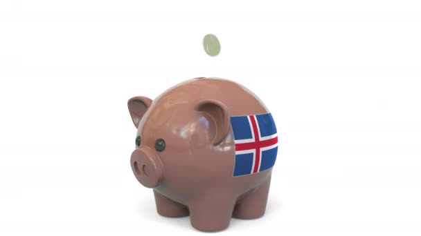 Putting money into piggy bank with flag of Iceland. Tax system system or savings related conceptual 3D animation — Stock Video