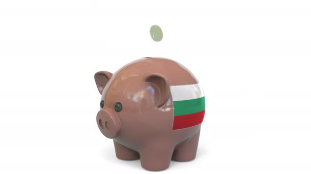 Putting money into piggy bank with flag of Bulgaria. Tax system system or savings related conceptual 3D animation — Stock Video