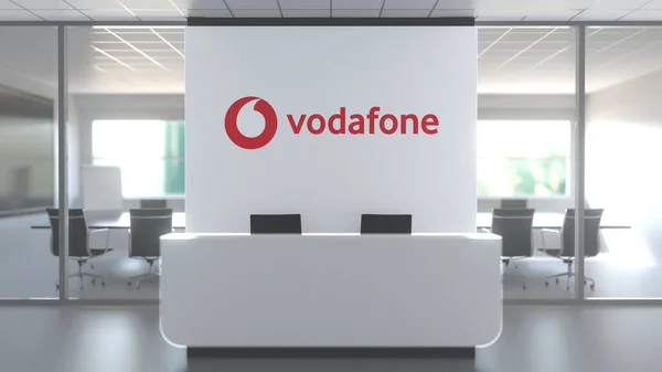 Logo Vodafone nad recepcí v moderní kanceláři, redakční koncepční 3D vykreslování — Stock fotografie