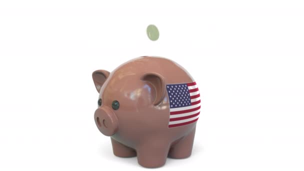 Putting money into piggy bank with flag of the United States. Tax system system or savings related conceptual 3D animation — Stockvideo