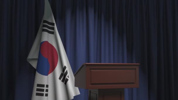 Флаг Южной Кореи и трибуна спикера. Политические события или заявления, связанные с концептуальной 3D анимацией — стоковое видео