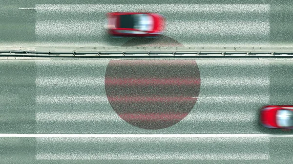 Vista aérea de cima para baixo de carros e bandeira do Japão na estrada. Viajando relacionado renderização 3D conceitual — Fotografia de Stock
