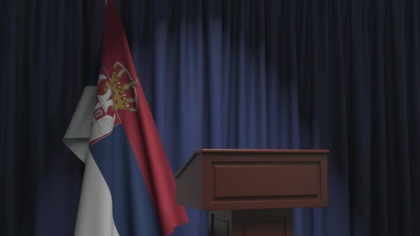 National flag of Serbia and speaker podium tribune. Political event or statement related conceptual 3D animation — ストック動画