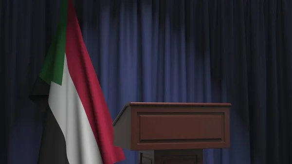 Государственный флаг Судана и трибуна спикера. Политическое событие или заявление, связанное с концептуальным 3D рендерингом — стоковое фото