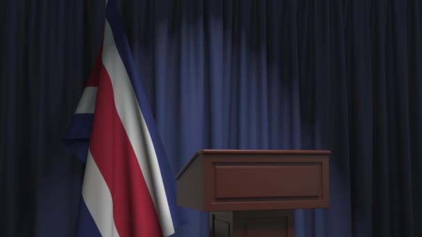 Флаг Коста-Рики и трибуна спикера. Политические события или заявления, связанные с концептуальной 3D анимацией — стоковое видео