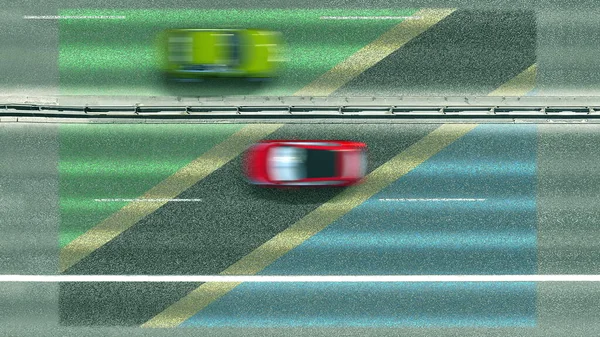 Vista aérea de cima para baixo de carros revelando bandeira da Tanzânia na estrada. Viajando relacionado renderização 3D conceitual — Fotografia de Stock