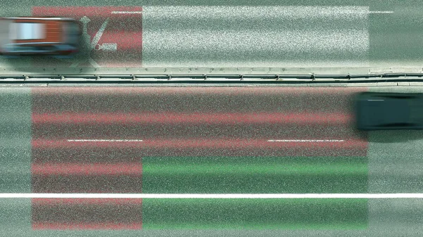 Aerial top down view of cars revealing flag of Oman on the road. Traveling related conceptual 3D rendering — Stock Photo, Image