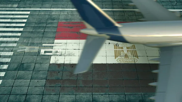 Flygfoto över ett landningsflygplan och Egyptens flagga på en flygplats. Begreppsmässig 3d-tolkning i samband med flygresor — Stockfoto