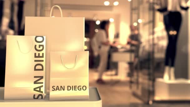 Shopping bags with San Diego text. Shopping in the United States related 3D animation — 图库视频影像