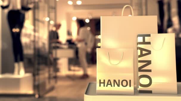 Shoppingväskor med Hanoi text. Shopping i Vietnam relaterade konceptuell 3D-animation — Stockvideo