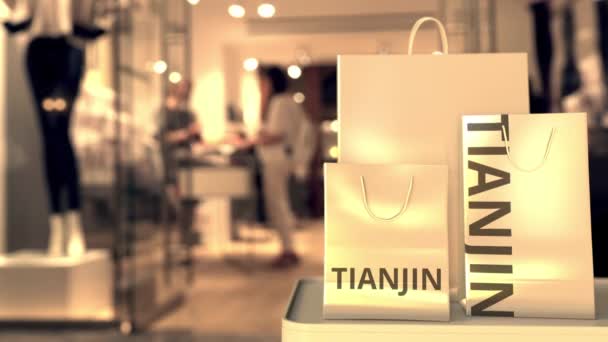 Sacchetti di carta con testo Tianjin. Shopping in Cina animazione 3D correlata — Video Stock