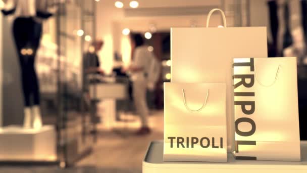 Papieren zakken met Tripoli tekst. Winkelen in Libië gerelateerde 3d animatie — Stockvideo