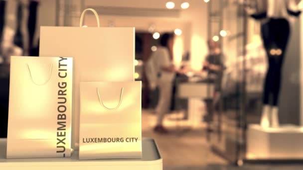 Bolsas con texto de la ciudad de Luxemburgo. Compras en Luxemburgo animación 3D relacionada — Vídeo de stock