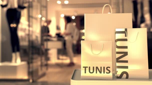 Sacos de compras com texto Tunis. Compras na Tunísia animação 3D relacionada — Vídeo de Stock