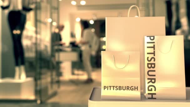 Tassen met Pittsburgh tekst. Winkelen in de Verenigde Staten gerelateerde 3d animatie — Stockvideo