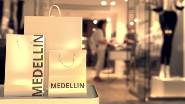 Papírové tašky s medellinským textem. Nakupování v Kolumbii související konceptuální 3D animace — Stock video