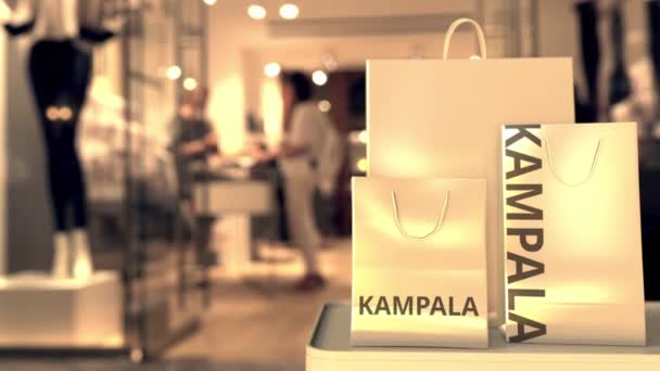 Bolsas con texto de Kampala. Compras en Uganda animación 3D relacionada — Vídeos de Stock