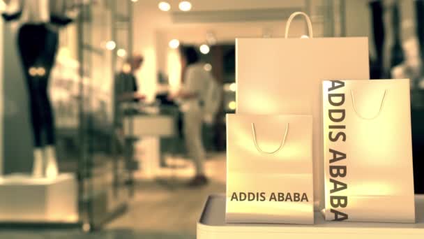 Nákupní tašky s textem Addis Abeby. Nakupování v Etiopii související 3D animace — Stock video