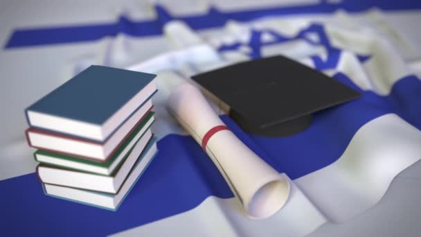 Tapa de graduación, libros y diploma en la bandera israelí. La educación superior en Israel relacionados con la animación 3D conceptual — Vídeos de Stock