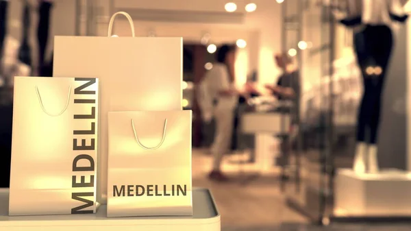Bolsas de papel con texto de Medellín. Compras en Colombia relacionadas con la representación conceptual 3D —  Fotos de Stock