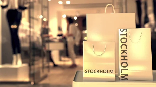 Shopping väskor med Stockholm bildtext mot suddig butiksentré. Shopping i Sverige relaterade 3D-rendering — Stockfoto