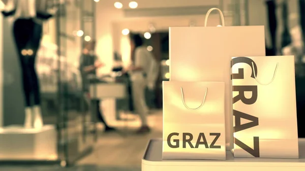 Taschen mit Graz-Text. Shopping in Österreich im Zusammenhang mit konzeptionellem 3D-Rendering — Stockfoto