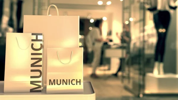 Sacos de papel com texto de Munique. Compras na Alemanha relacionadas com a renderização 3D — Fotografia de Stock