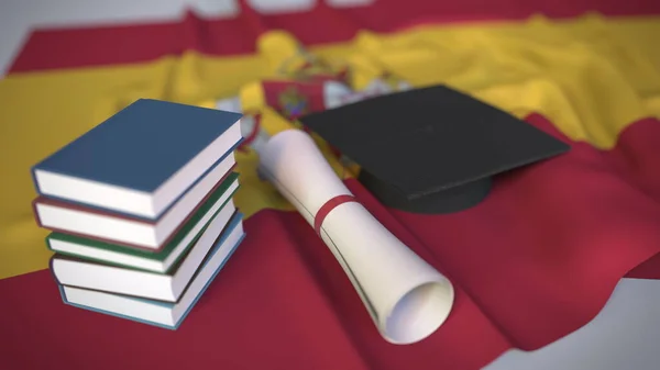 Graduation cap, books and diploma on the Spanish flag. Higher education in Spain related conceptual 3D rendering — Stock Photo, Image