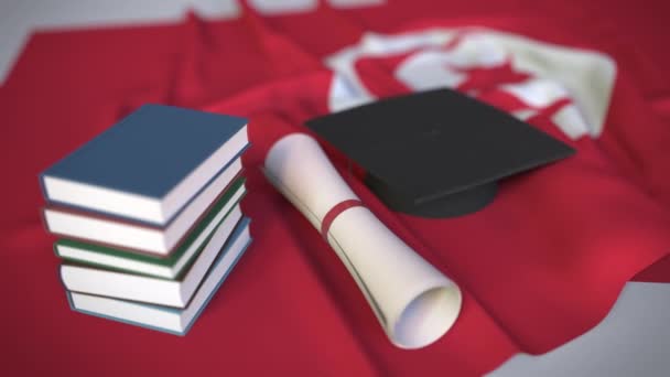 Berretto di laurea, libri e diploma sulla bandiera tunisina. L'istruzione superiore in Tunisia relativa all'animazione concettuale 3D — Video Stock