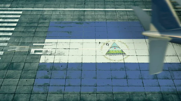 Luftaufnahme eines landenden Flugzeugs und der Flagge Nicaraguas auf dem Flugplatz eines Flughafens. Luftfahrt bezogene konzeptionelle 3D-Darstellung — Stockfoto
