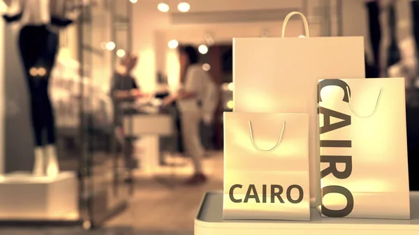 Papieren tassen met Cairo tekst. Winkelen in Egypte gerelateerde conceptuele 3d rendering — Stockfoto