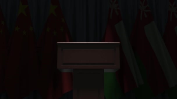 Drapeaux de Chine et Oman et tribune haut-parleur podium. Evénement politique ou négociations liées à l'animation 3D conceptuelle — Video