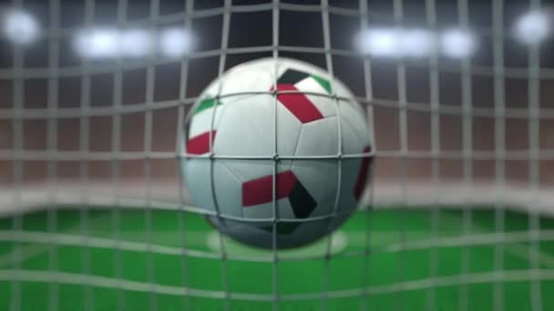 Football with flags of Kuwait in net against blurred stadium. Conceptual 3D animation — Stock Video