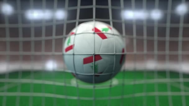 Football with flags of Lebanon in net against blurred stadium. Conceptual 3D animation — Stock Video