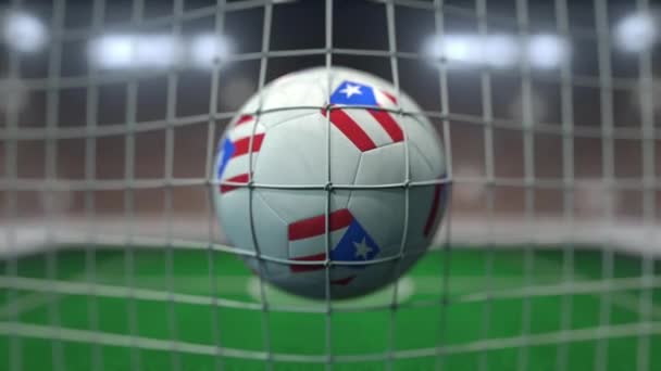 Football with flags of Puerto Rico in net against blurred stadium. Conceptual 3D animation — ストック動画