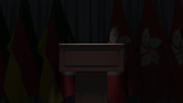 Flags of Germany and Hong Kong and speaker podium tribune. Political event or negotiations related conceptual 3D animation — Stock Video