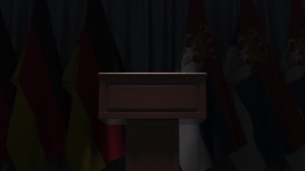 Veel vlaggen van Servië en Duitsland achter speaker tribune, 3d animatie — Stockvideo