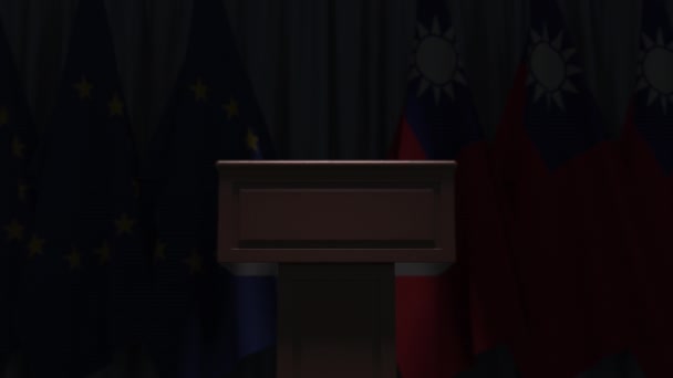 Row of flags of Taiwan and the European Union EU and and speaker tribune, conceptual 3D animation — ストック動画