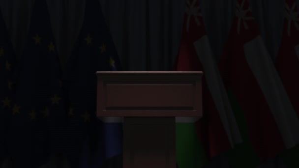 Flags of Oman and the European Union at international meeting, 3D animation — Stock Video